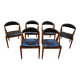 Set of 6 vintage Kai Kristiansen chairs in solid teak and black faux leather.