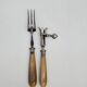 Set of silver-plated leg of lamb handles and fork, with horn handles.