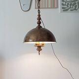 Rustic old wooden and brass suspension.