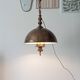 Rustic old wooden and brass suspension.