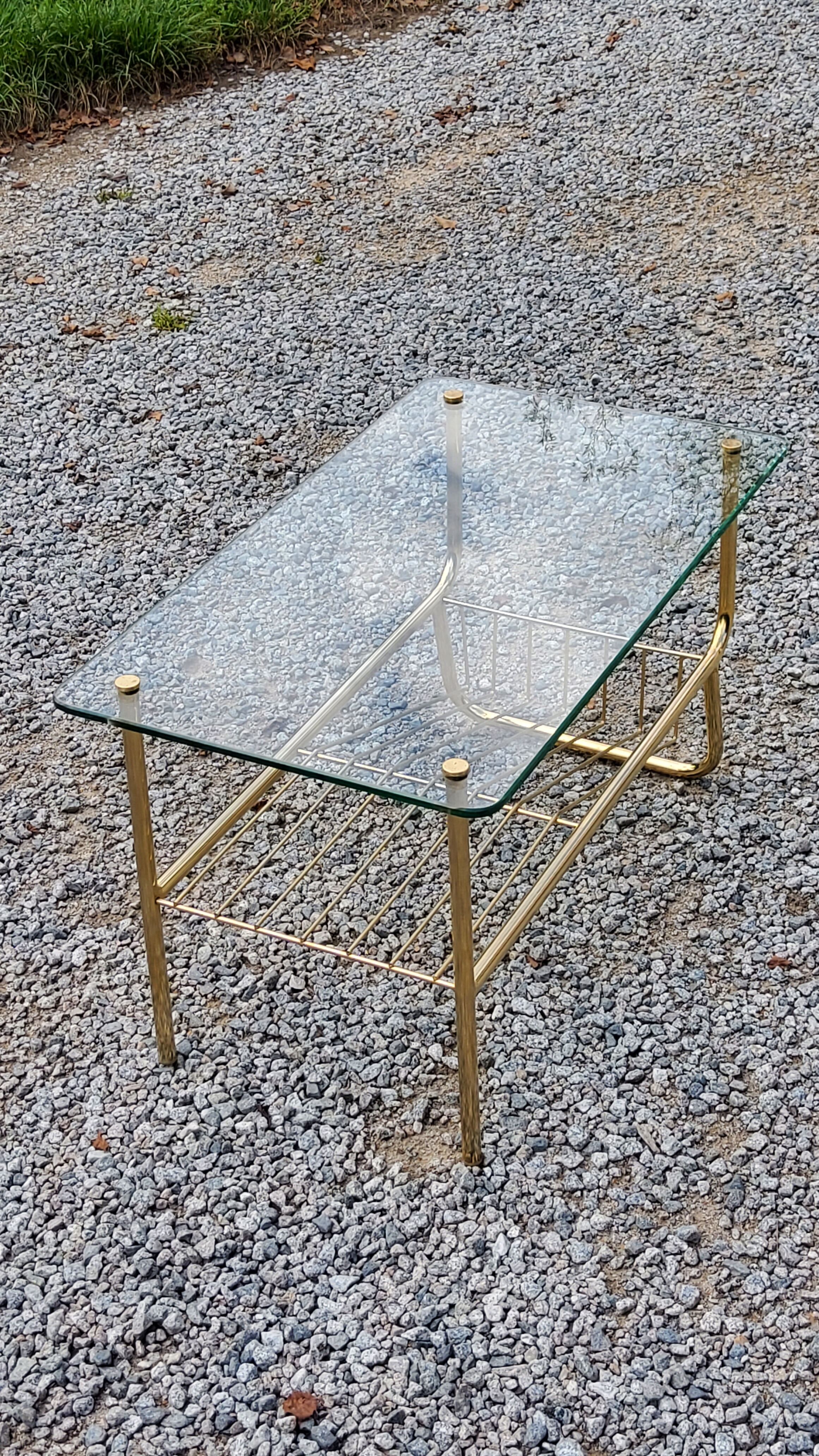 Coffee table from the 60s top glass base metal gilded