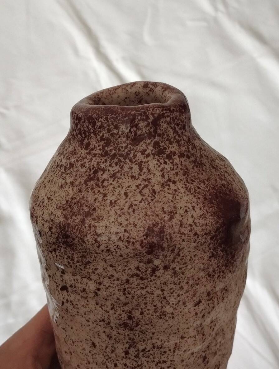White ceramic vase with brown speckles