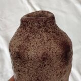 White ceramic vase with brown speckles