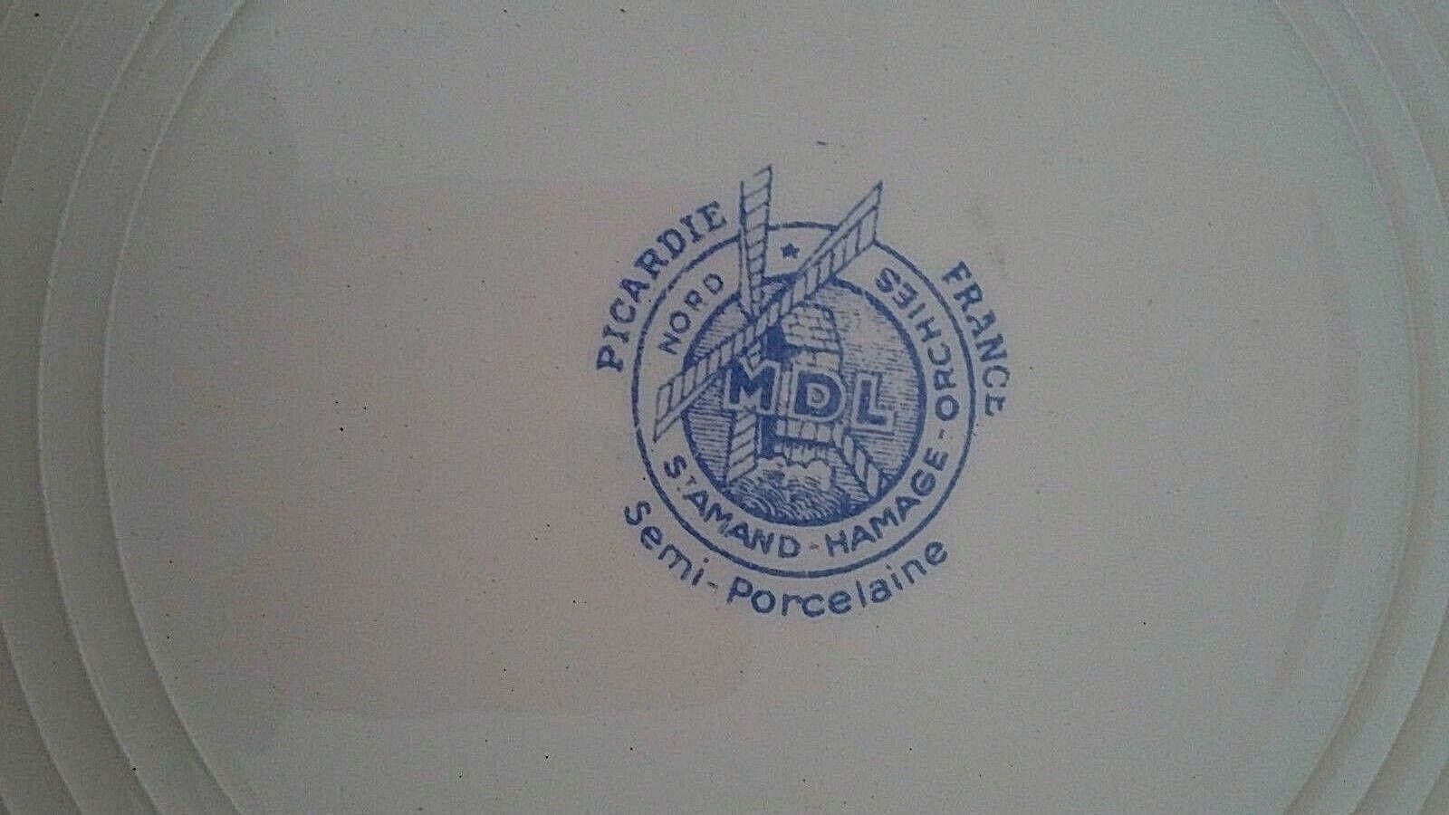 Hollow earthenware dish Saint Amand early twentieth floral decoration