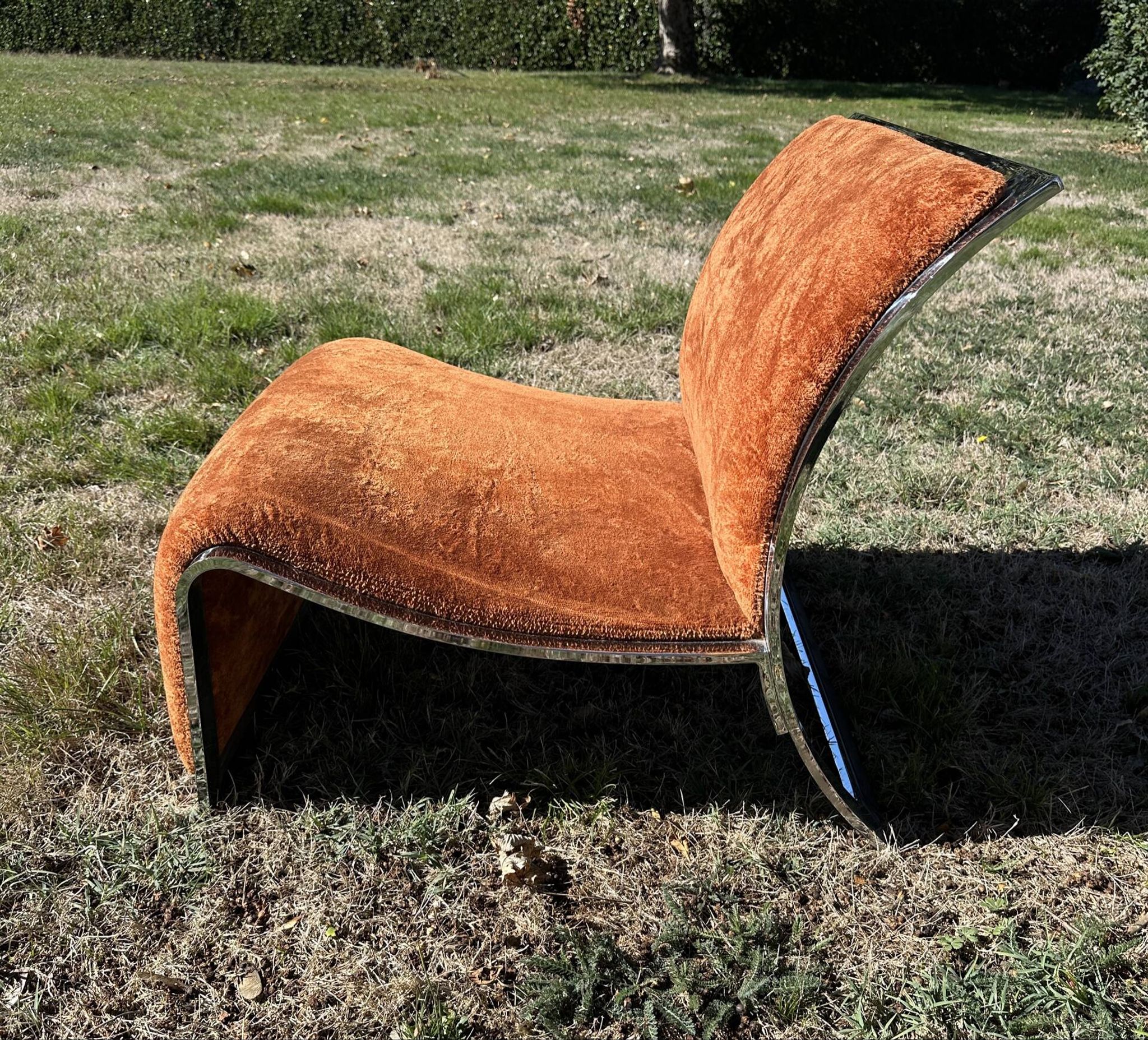 Chrome steel armchair and orange fabric by Vittorio Introini