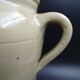 Grease pot with burgundy sandstone spout