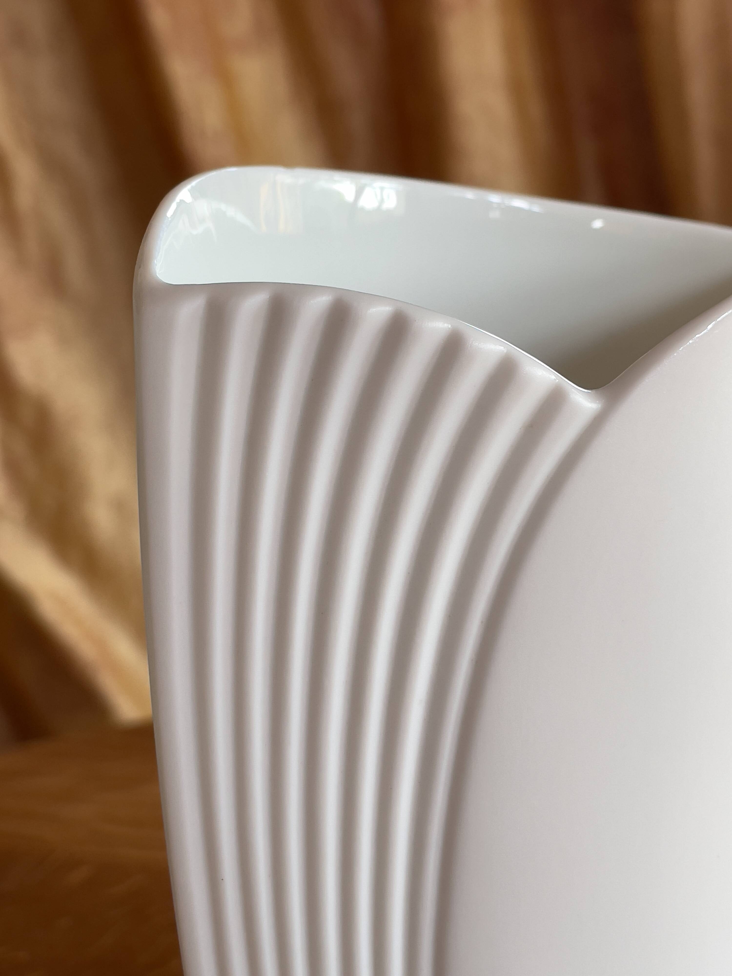 Vintage white porcelain vase AK Kaiser. It is signed Manfred Frey, 1960
