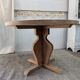Round table in raw oak