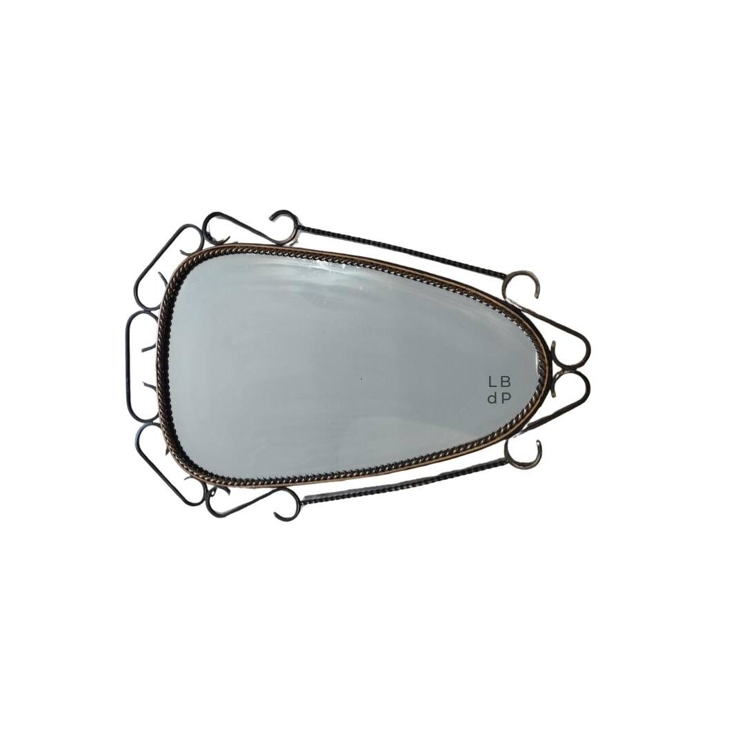Mid-century modern iron mirror, brutalist, vintage organic, thick sixties.