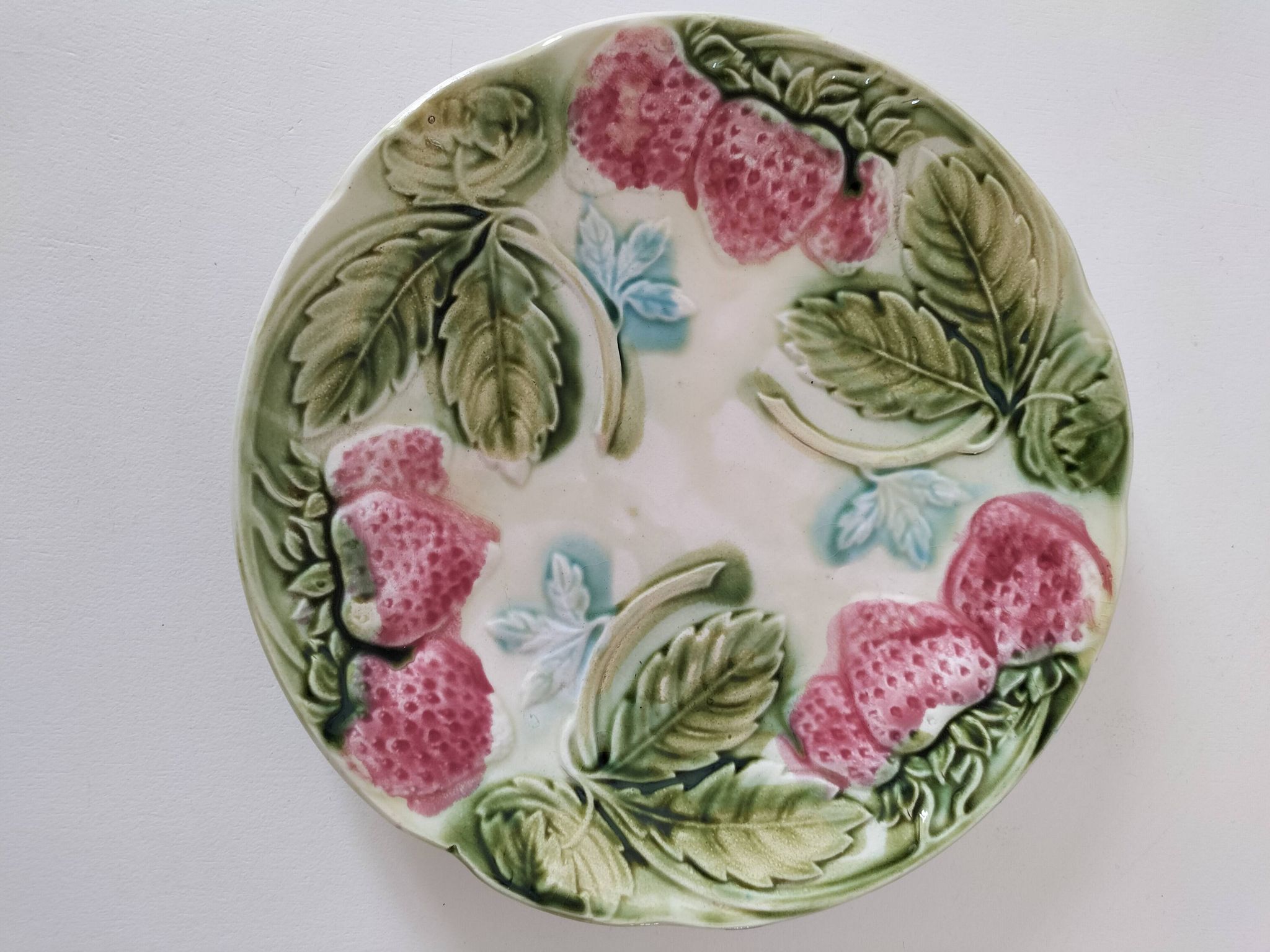 Barbotine plate with strawberries in relief, late 19th and early 20th century