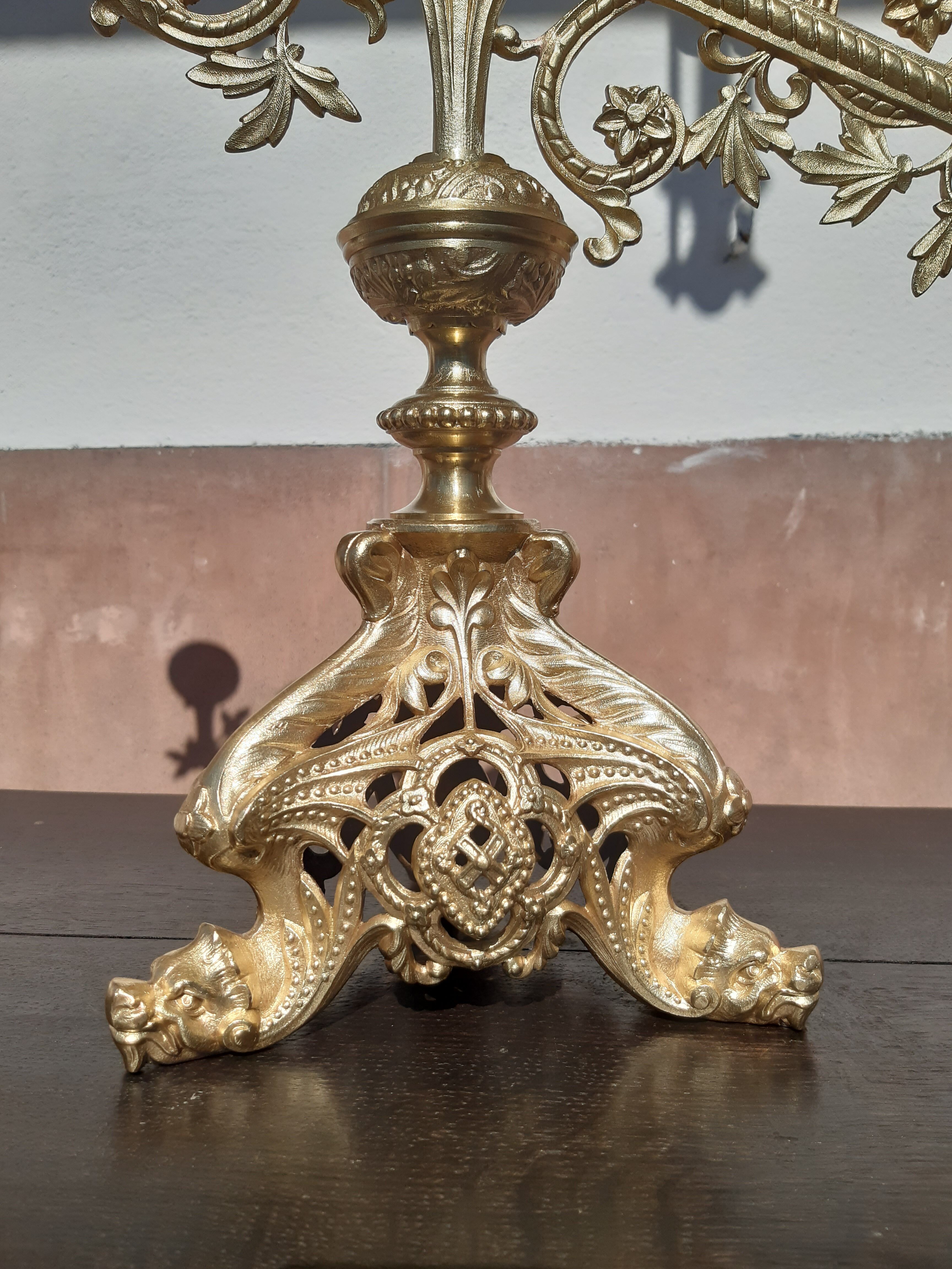 Antique candle holder in bronze and brass nineteenth century.