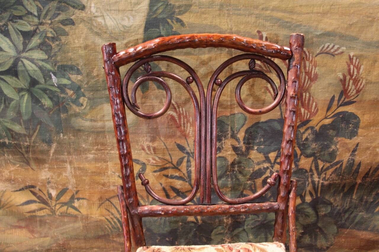 Folk art chair, black forest in branches