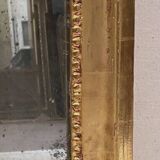 Louis XVI mirror in carved and gilded wood with leaf 18th century