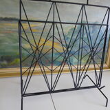 Magazines rack with very fine black metal geometric