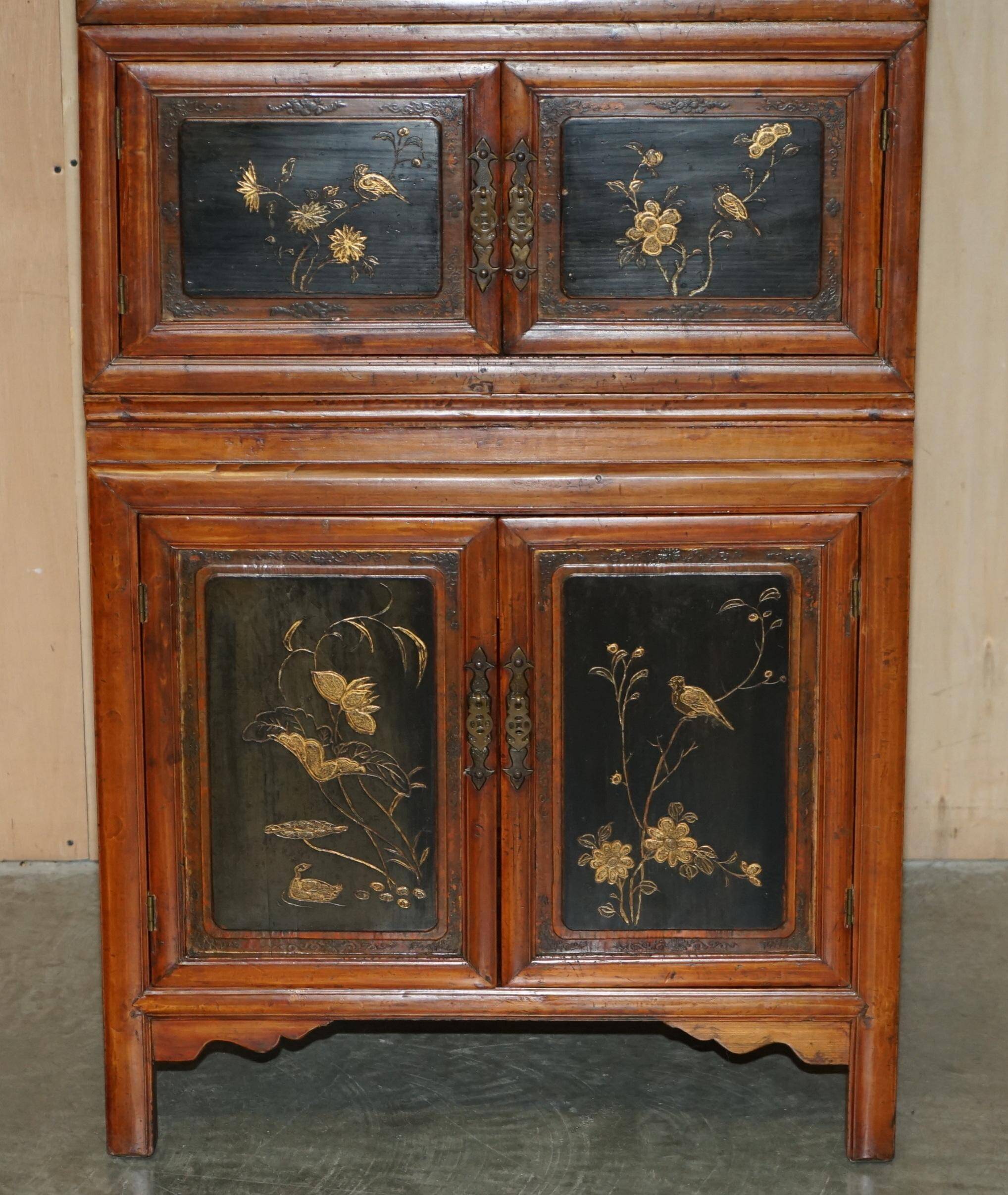 Antique Chinese armoire hand-carved around 1880 with country-style handles.