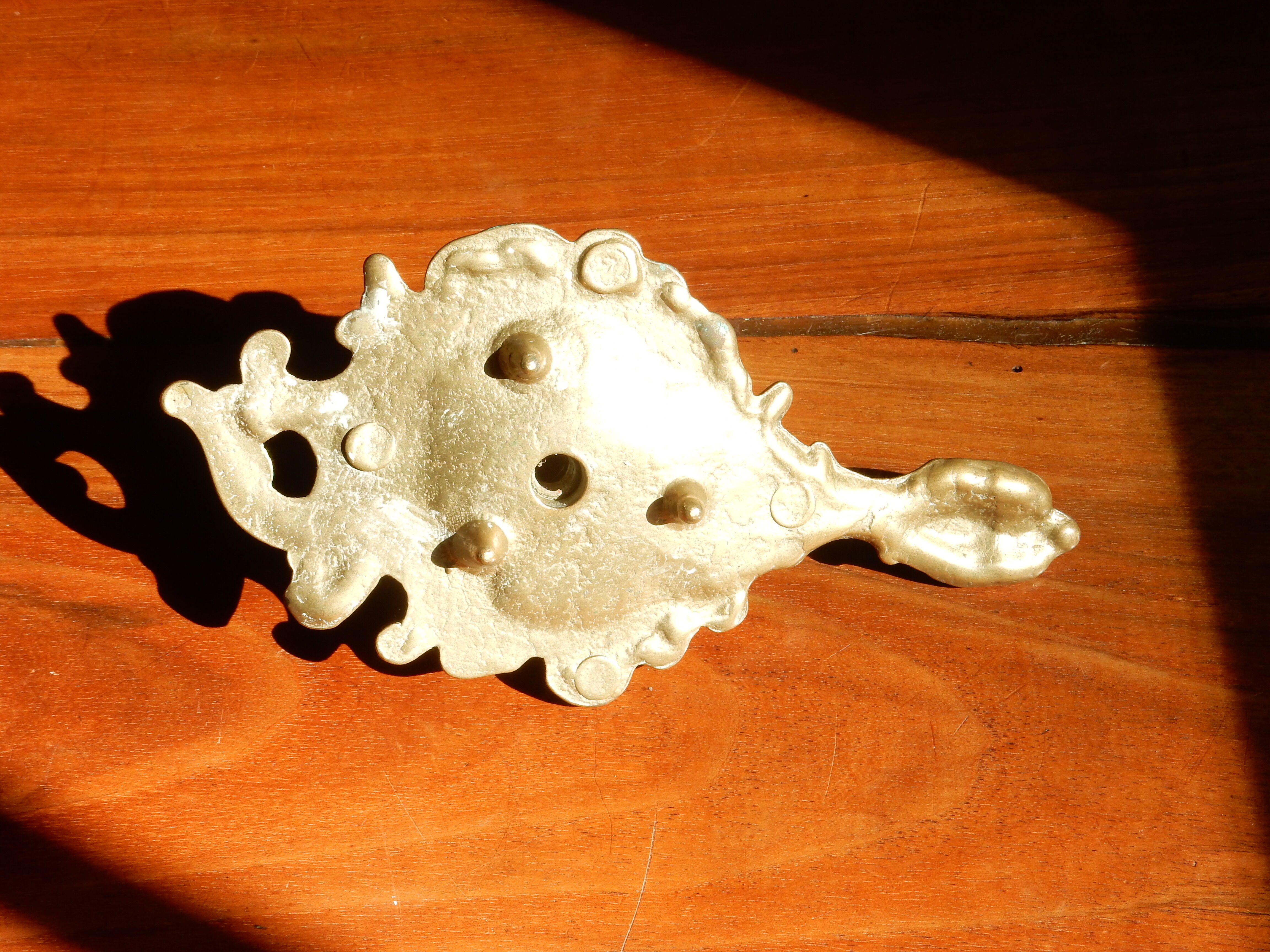 Bronze hand candle holder, cellar rat