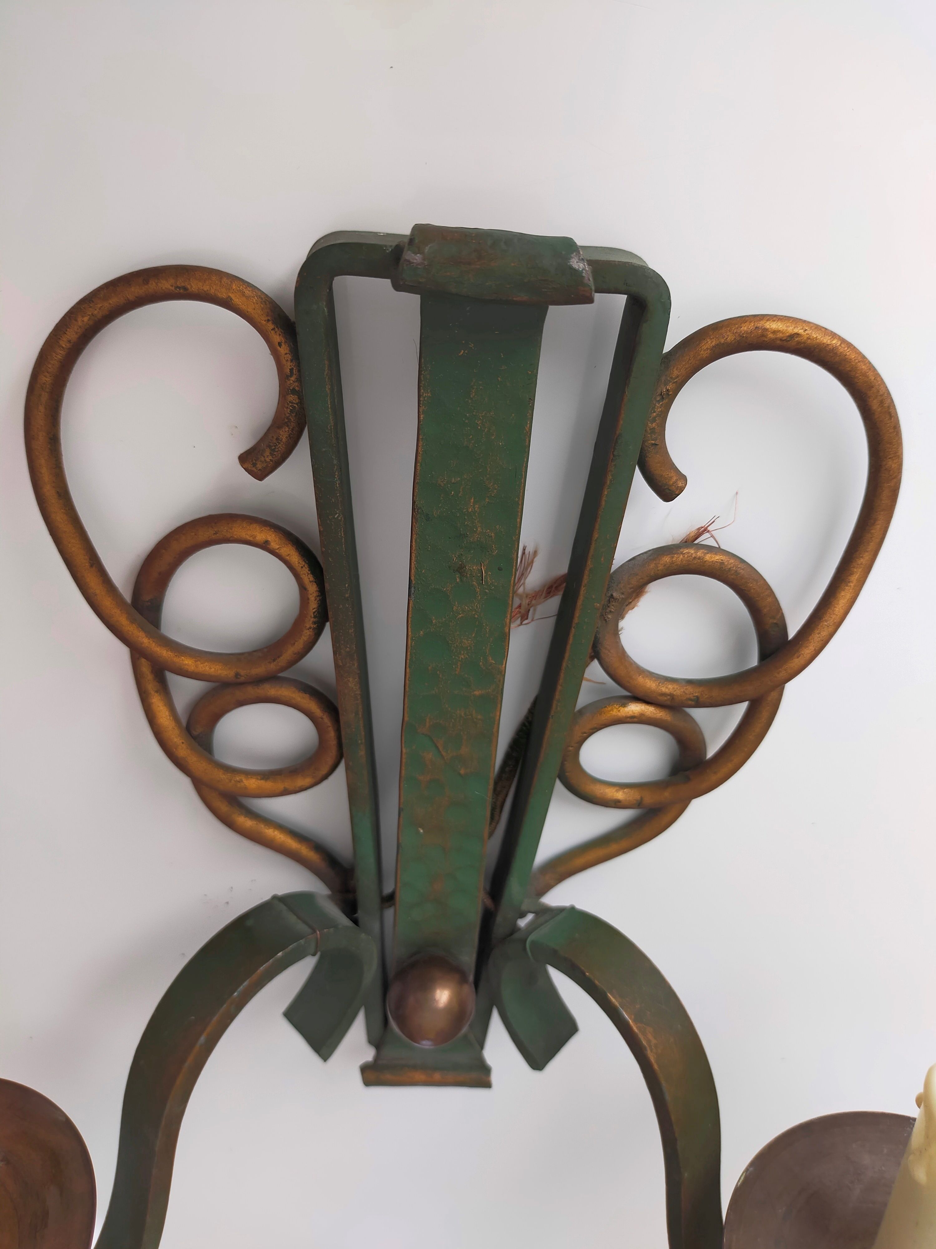 Pairs of vintage wrought iron wall lamps