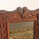 Tramp Art mirror from the 19th century in hand-carved wood.