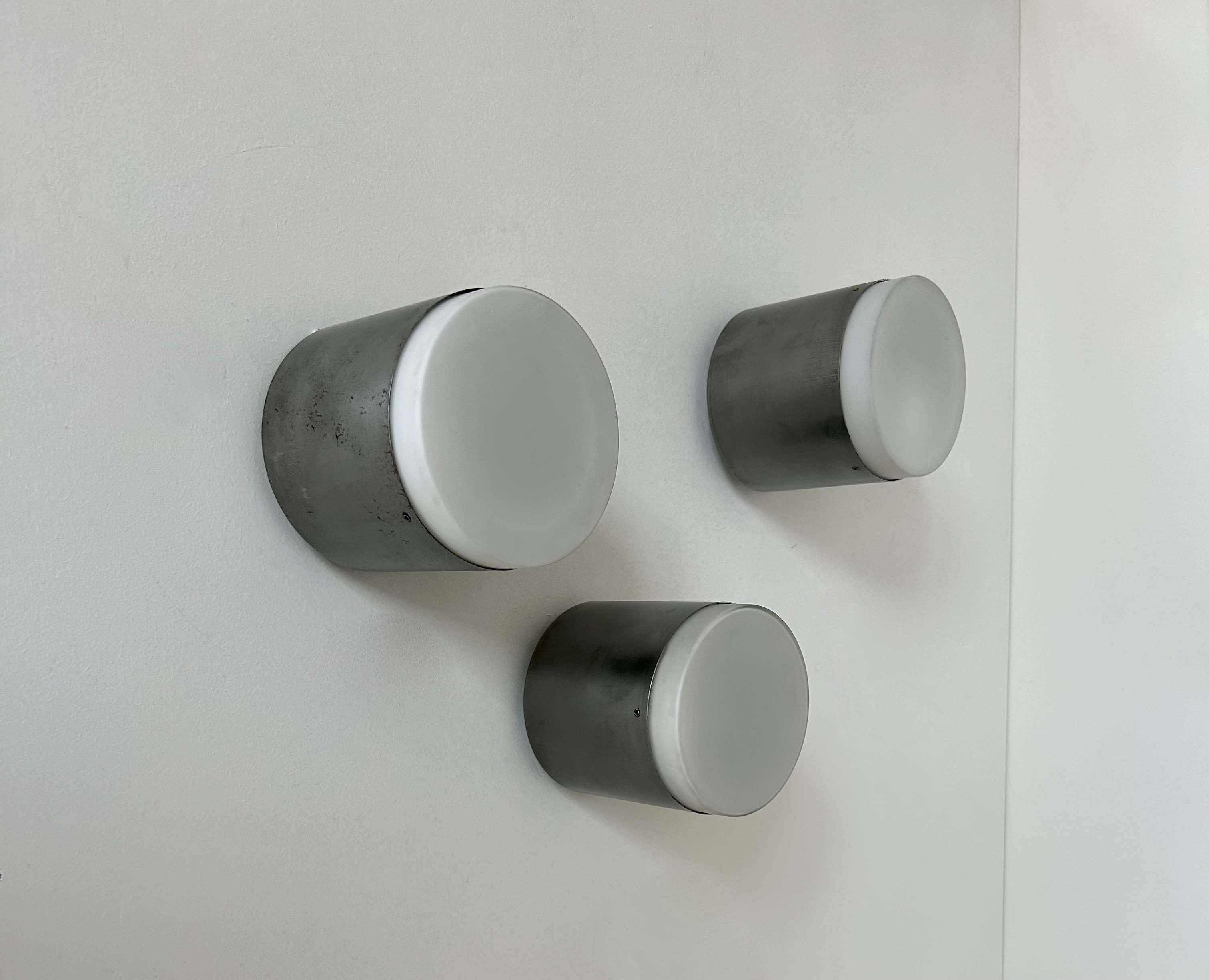 Set of 3 vintage Raak wall lights, aluminum and opaline, Holland 1960