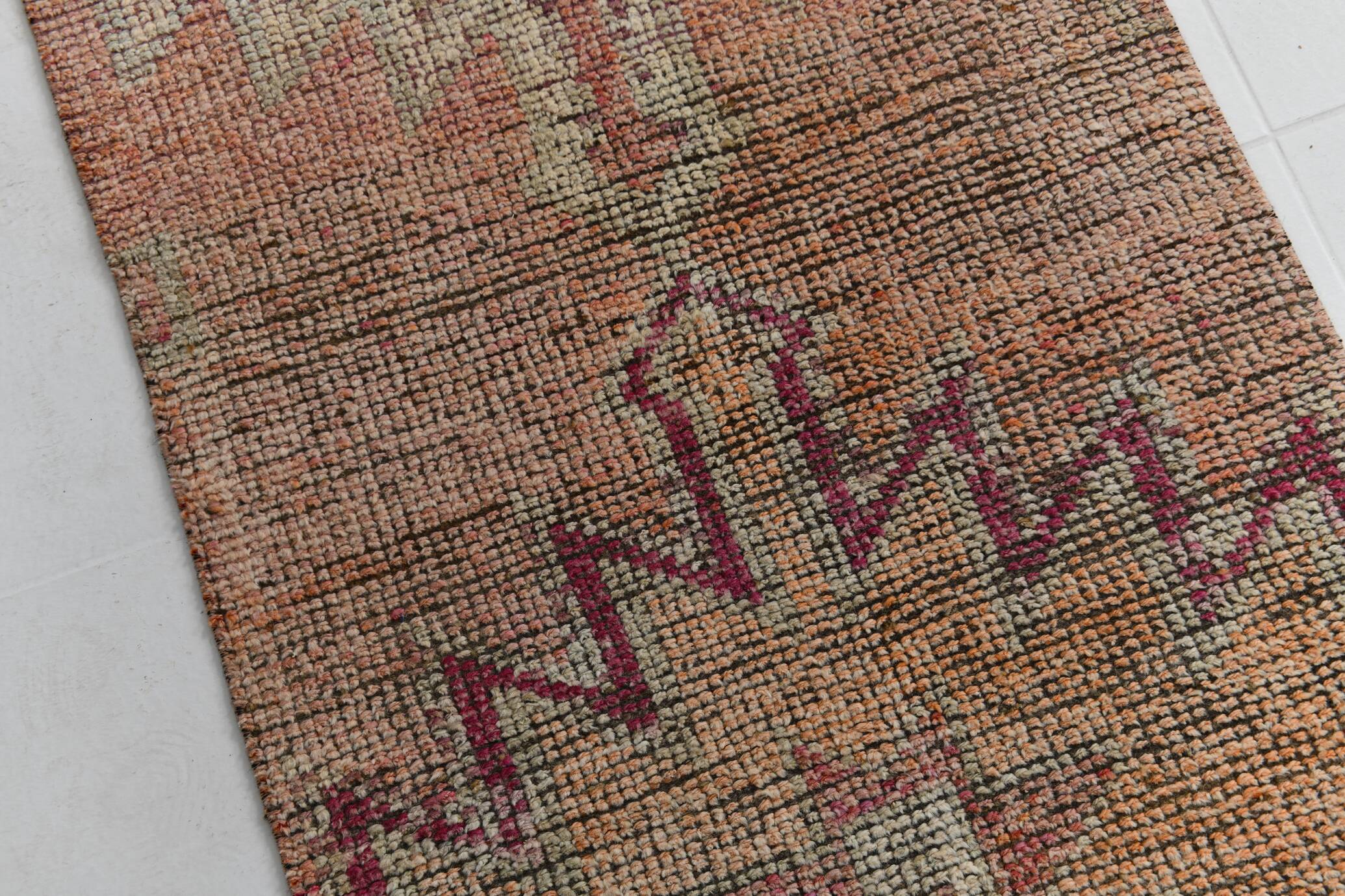 2x12 shades of pale orange vintage runner rug