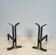 Pair of modernist and wrought iron fire dogs