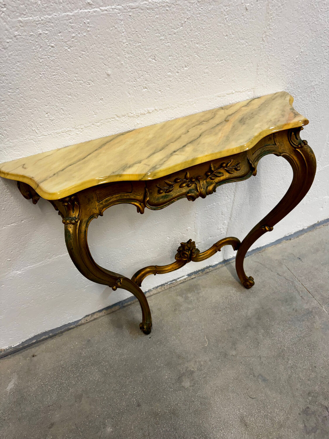 Carved gilded wooden console and marble in Louis XV style