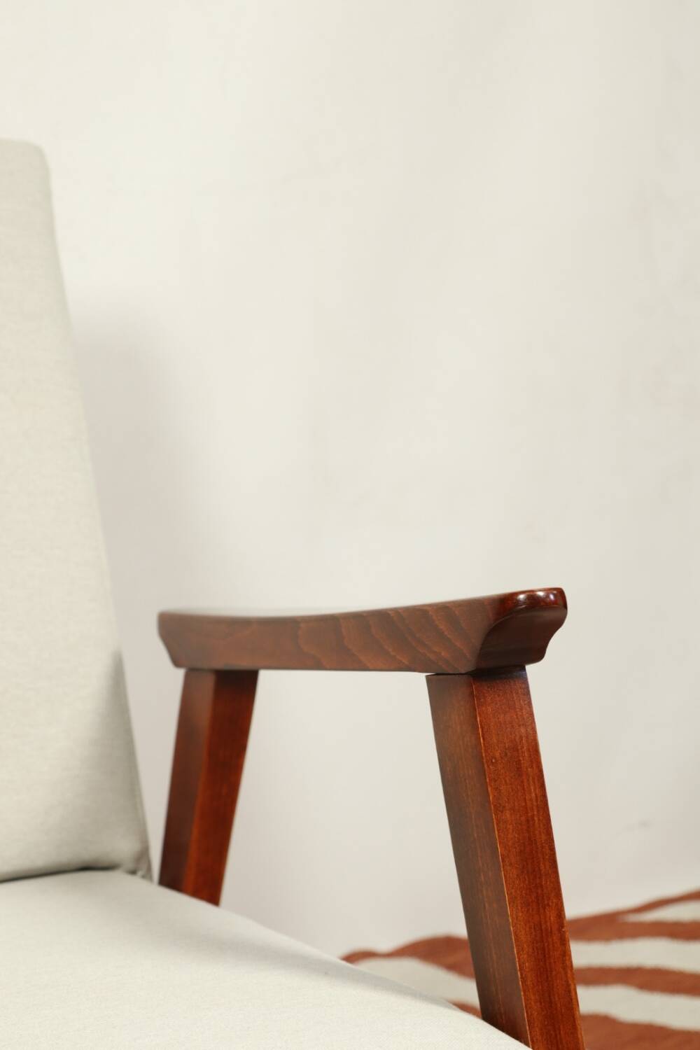 Vintage light gray armchair dark wood Scandinavian design 1970