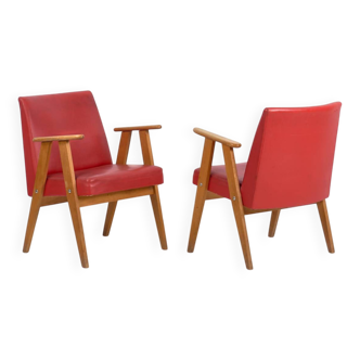 2 red armchairs, circa 1960