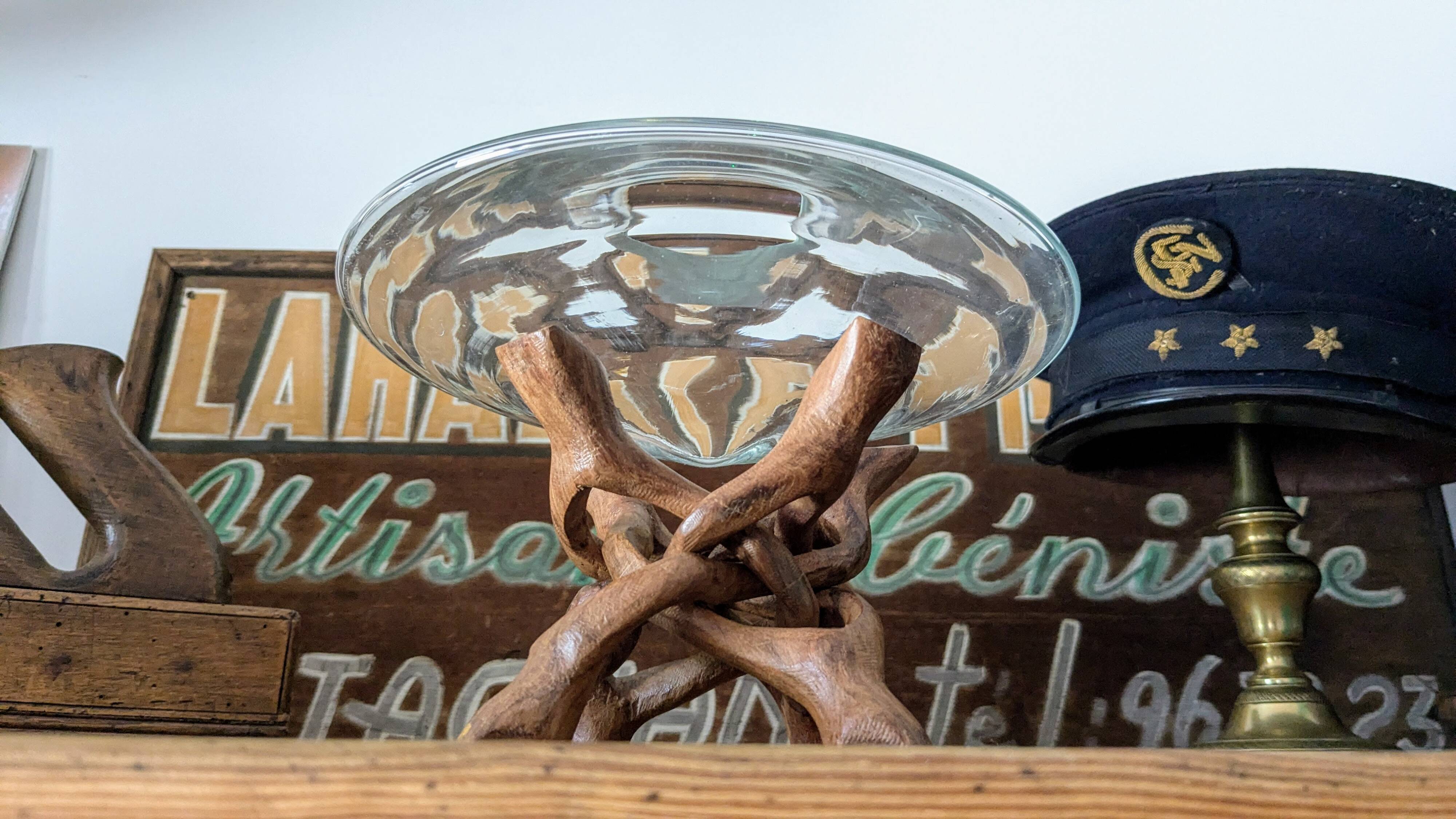 Glass cup molded on carved exotic wood