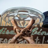 Glass cup molded on carved exotic wood