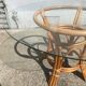 Rattan and glass dining table