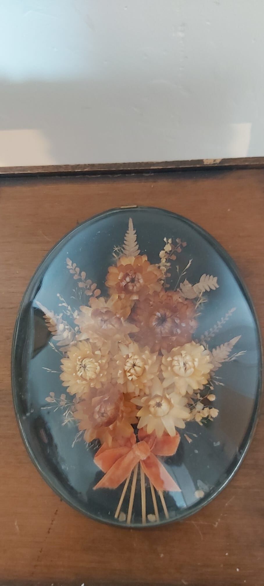 3 frames of dried flowers in curved glass