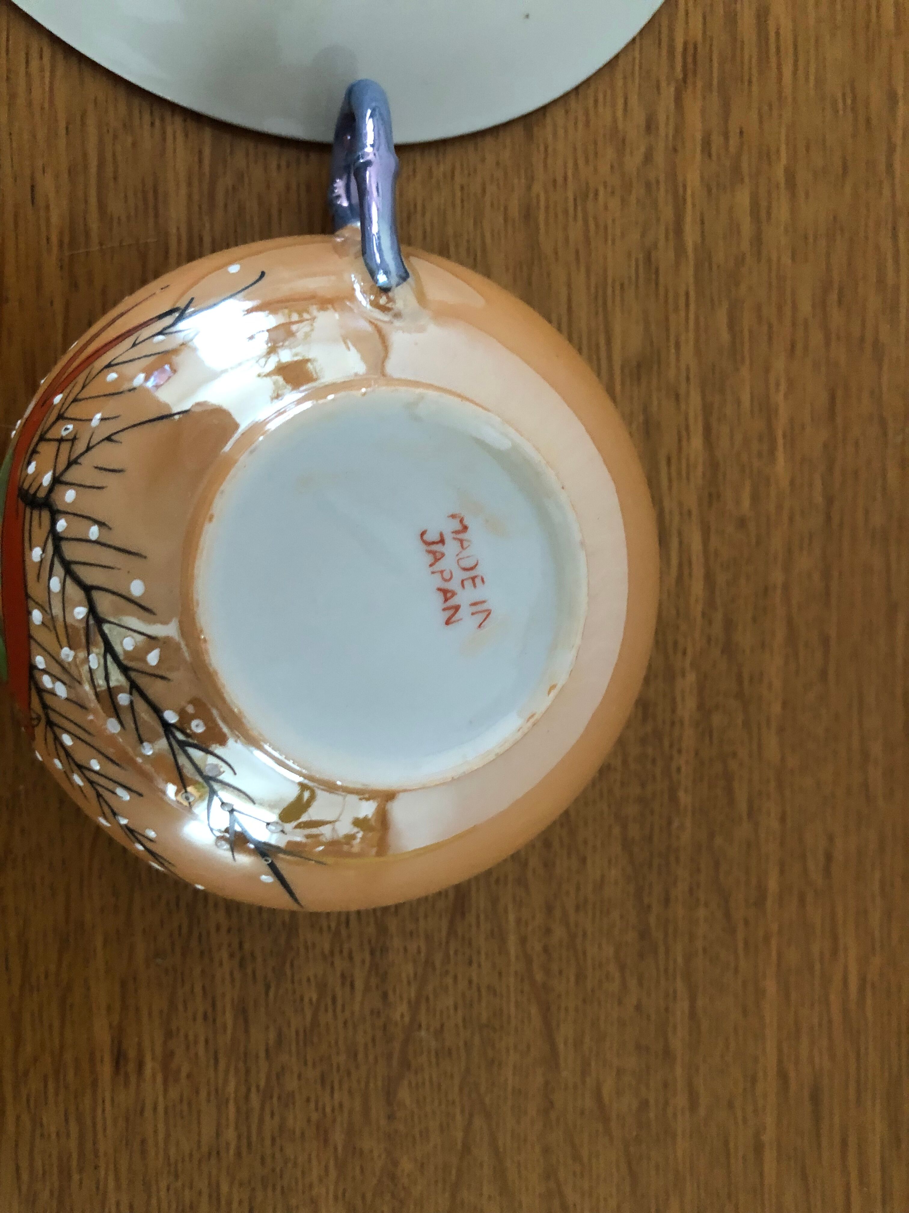 Coffee cup and under cup or tea made of iridescent Japanese porcelain