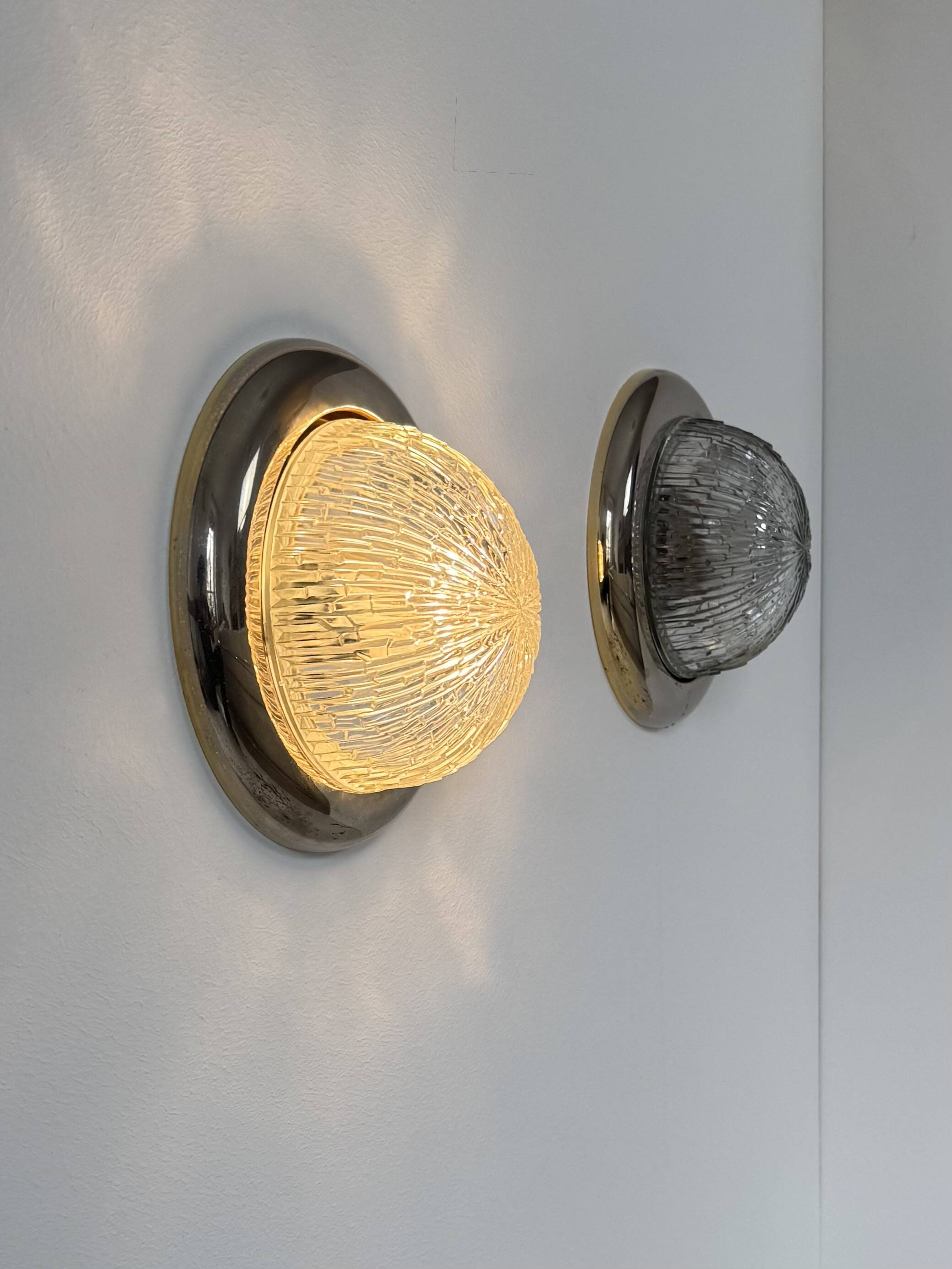 Pair of vintage wall lights, brass and pressed moulded glass, France, 1960.