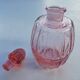 Pink molded glass bottle