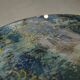 Neo-classical cast iron and glass eglomisé coffee table from the 1940s.