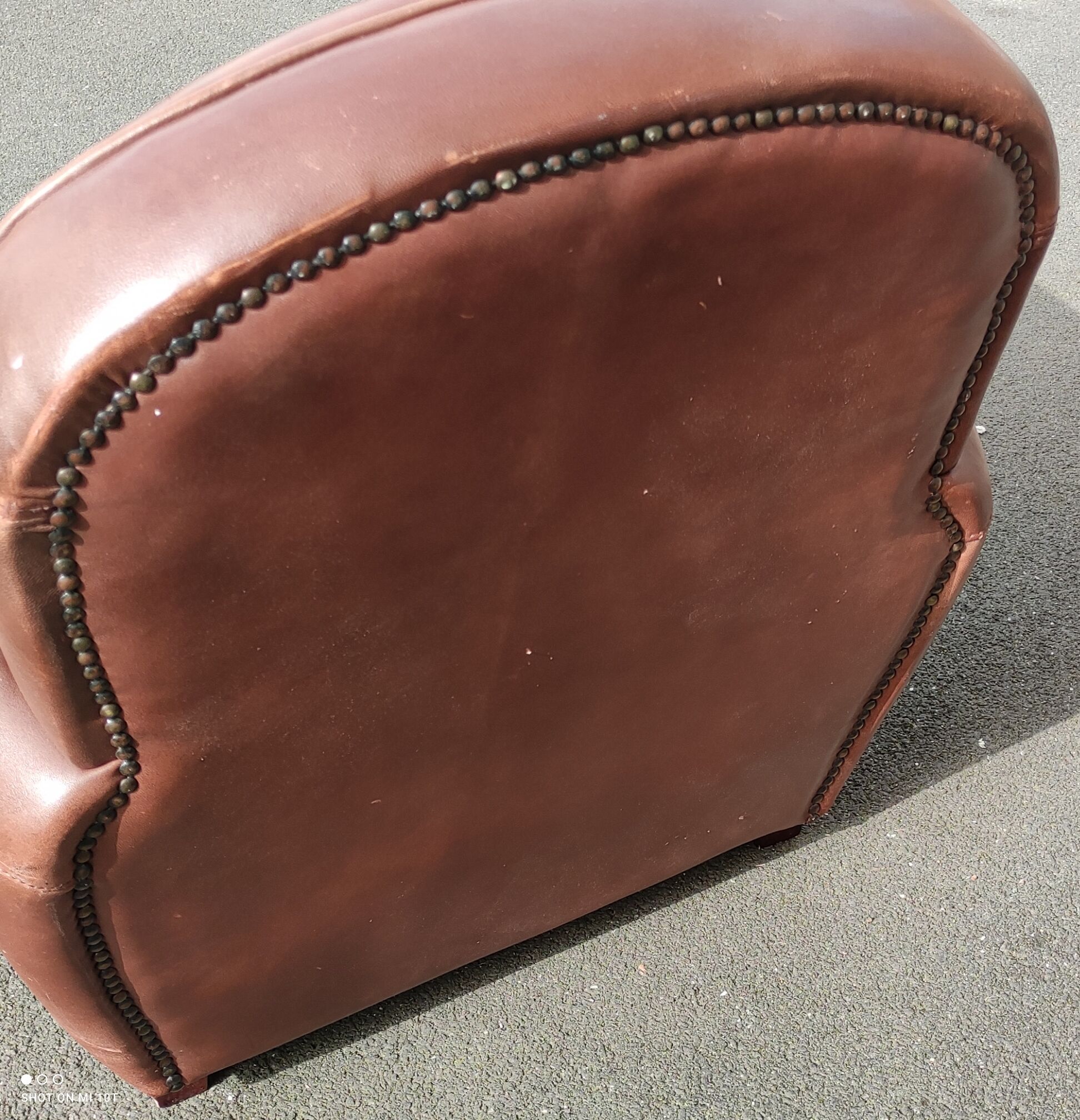 Club chair in brown leather