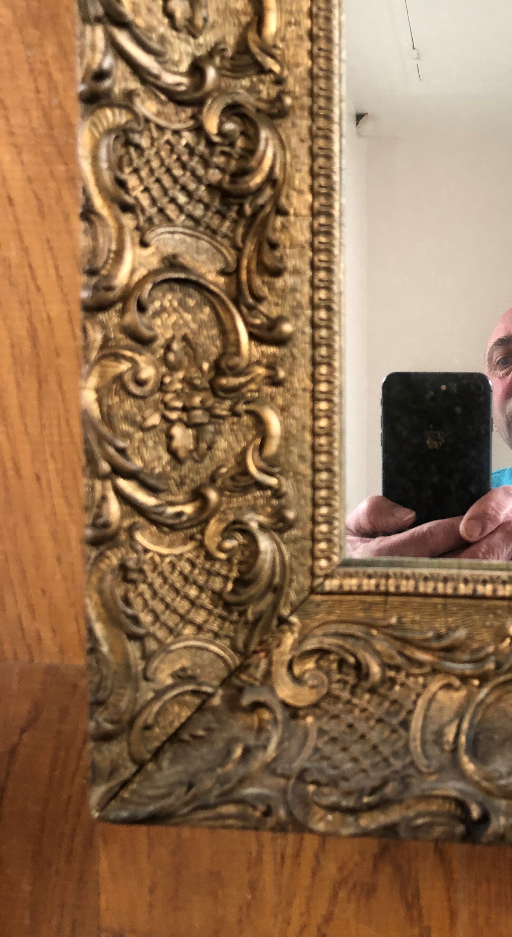 Carved and gilded wooden mirror