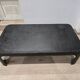 Industrial coffee table in riveted metal from around 1920 – black patina – 145 × 80 cm