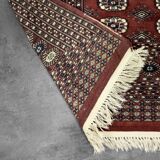 Handwoven red Boukhara oriental rug, 1960s