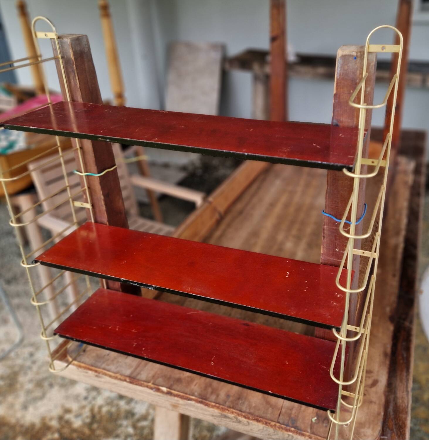 Gold metal wall shelf