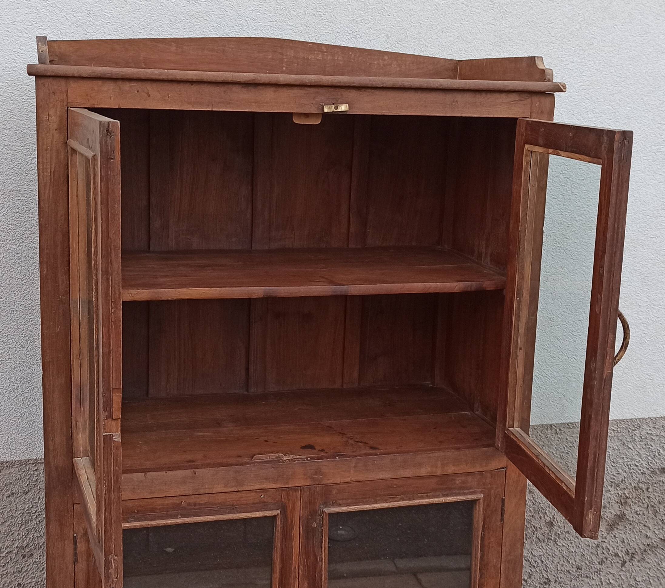 Old wooden glazed cabinet with four doors