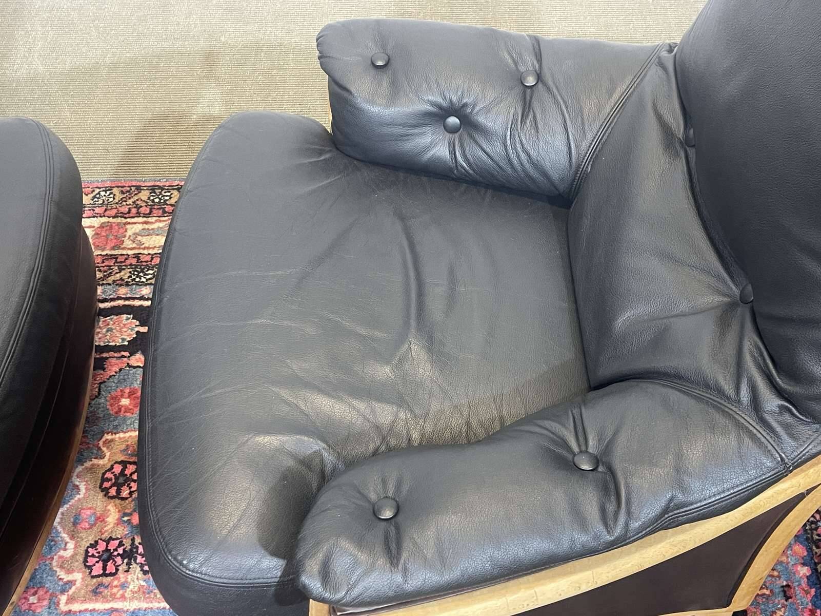Pair of leather and beech armchairs from the 1970s.