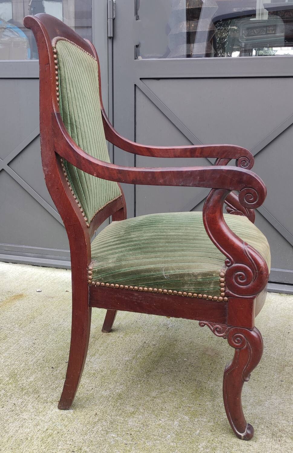 Old green velvet armchair