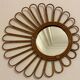 Old vintage asymmetrical round rattan mirror
