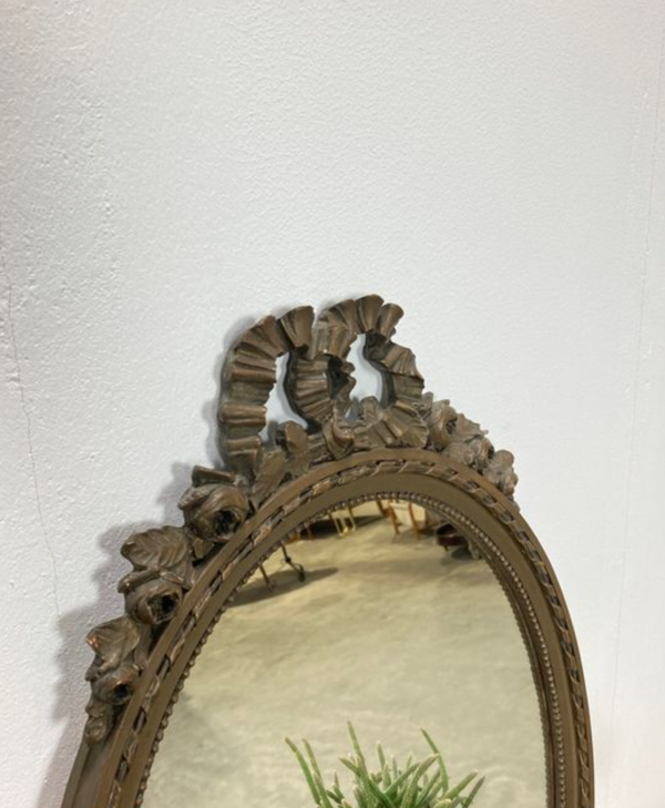 Vintage wooden mirror with arch and flowers