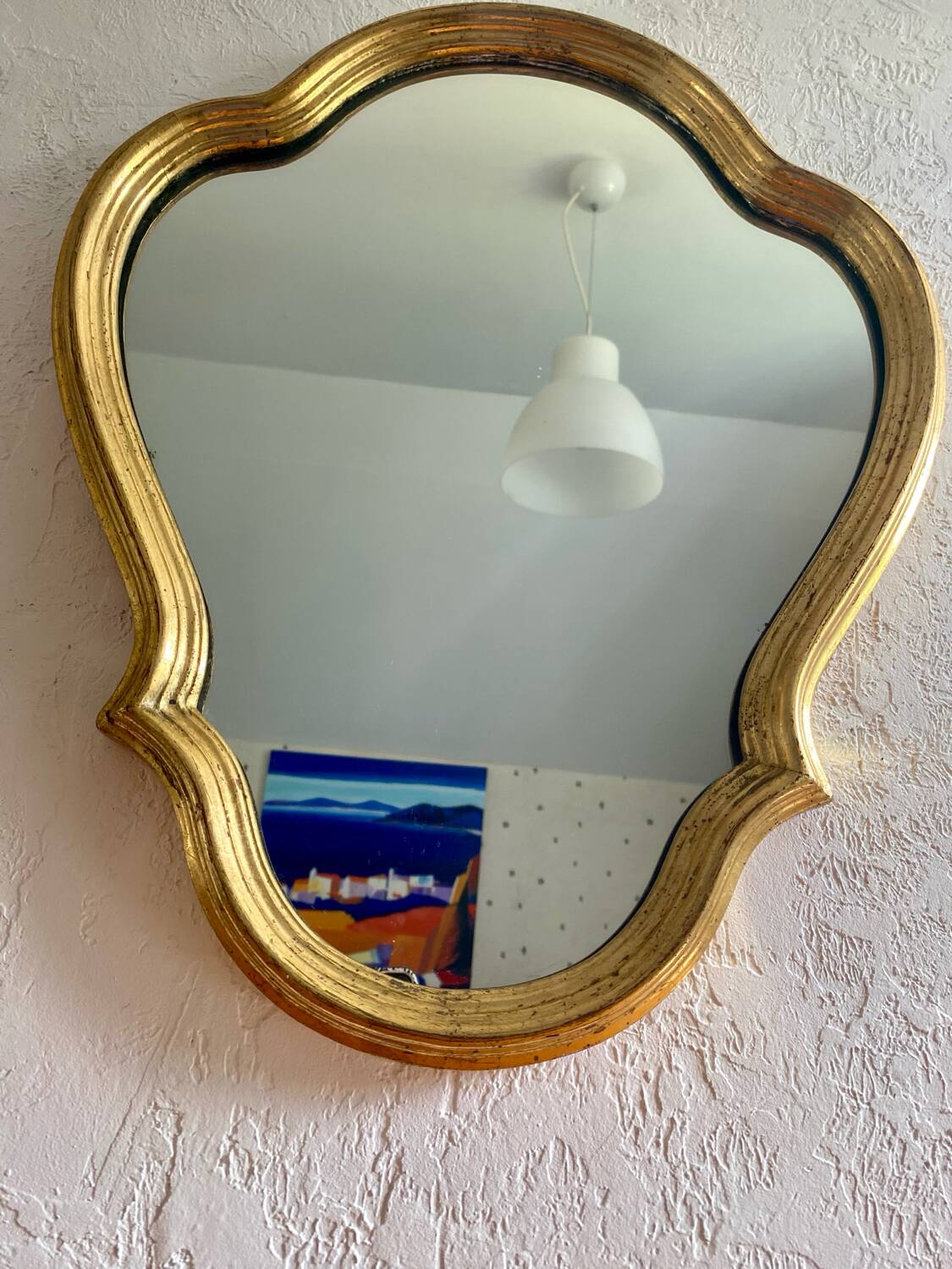 Wall mirror in a gilded wooden frame