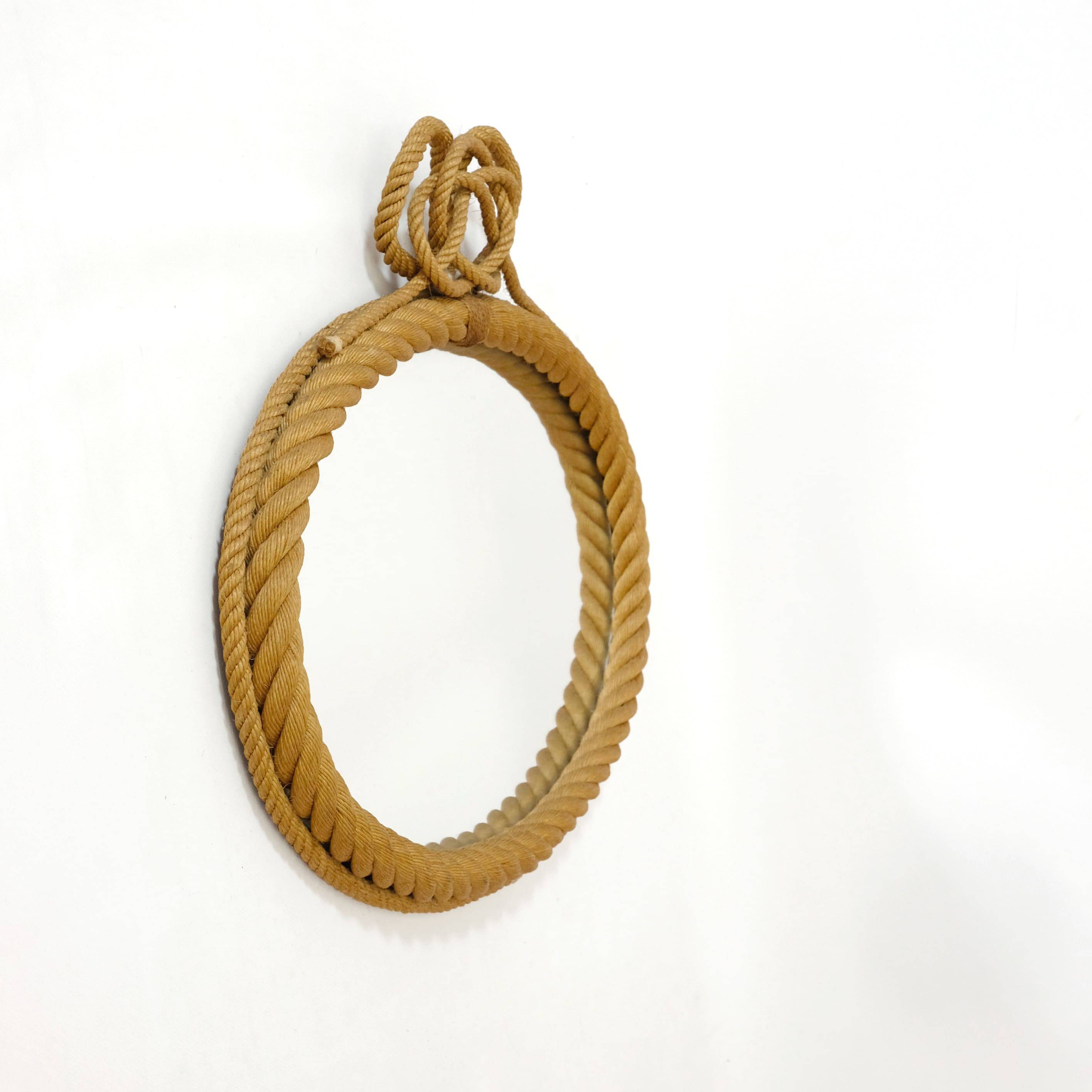 Large oval mirror in rope with pediment, 64cm x 56.5cm.