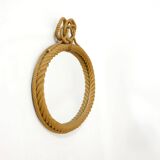 Large oval mirror in rope with pediment, 64cm x 56.5cm.
