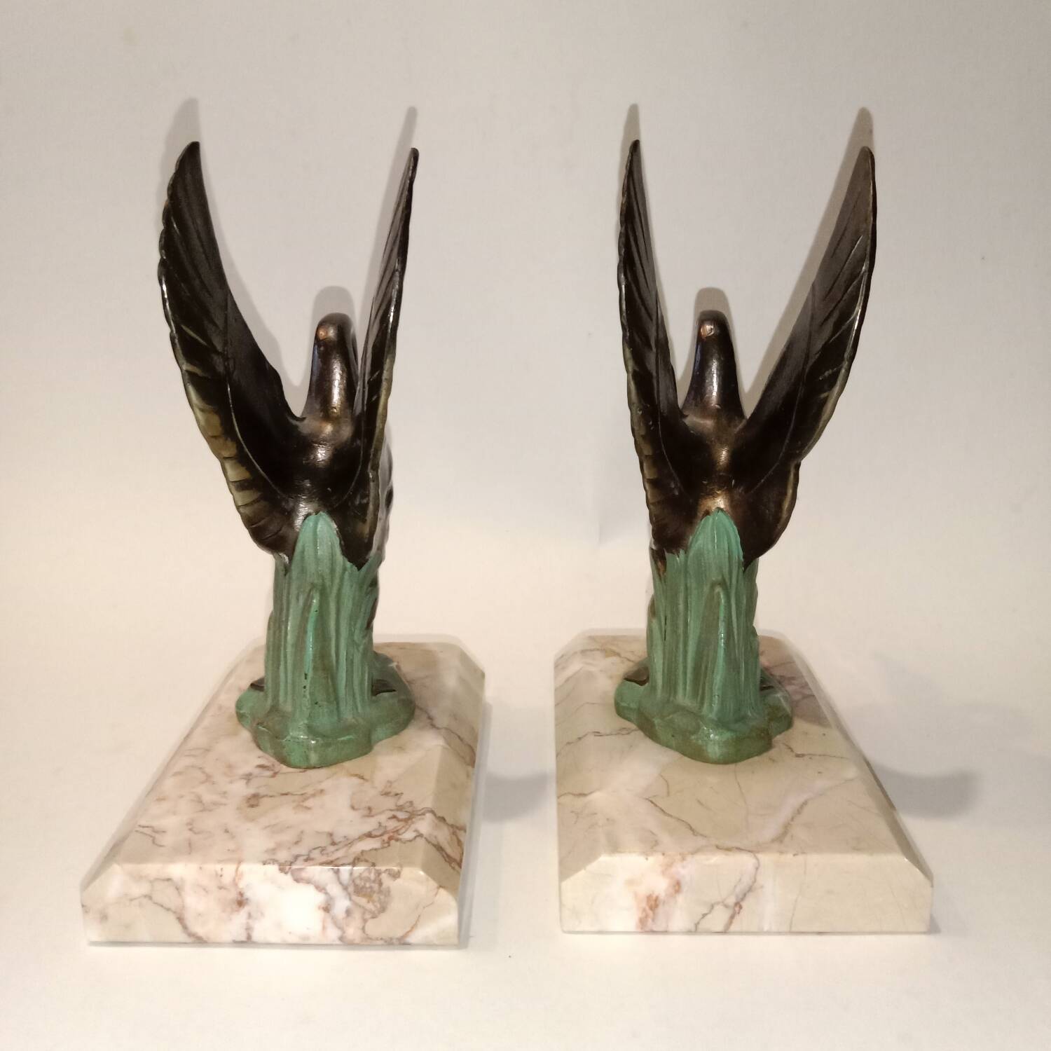 Art Deco bookends with metal swans, double patina and marble base.